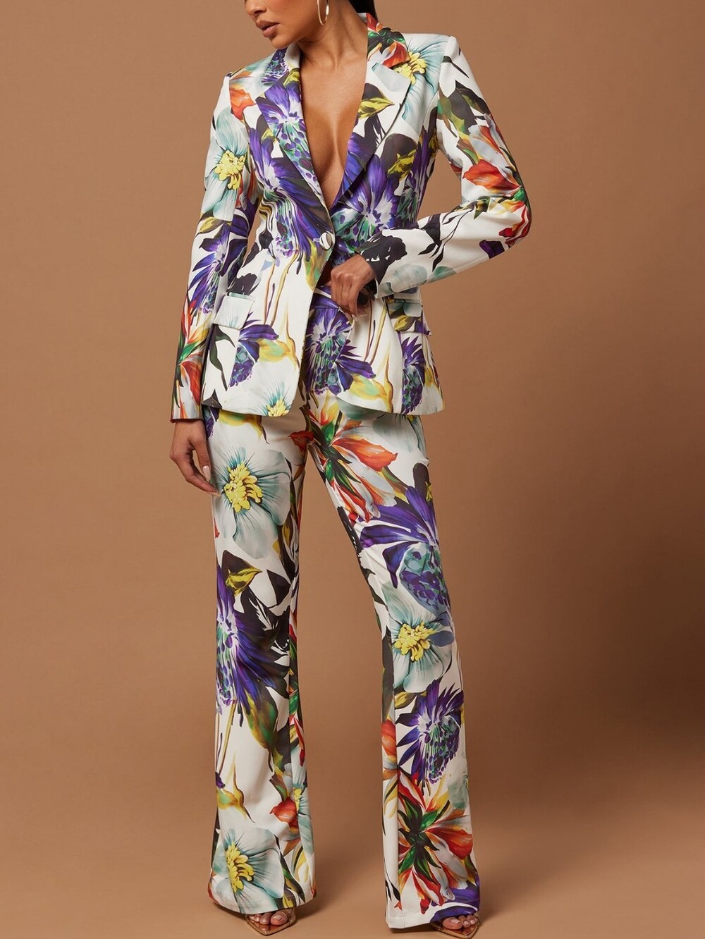 Women's trouser suit with a bright floral print: fitted blazer and flared trouse